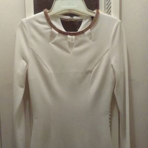 Long sleeve white dress with sown in golden neck